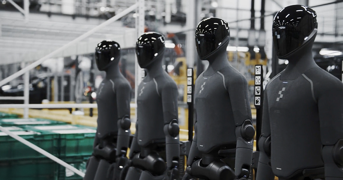 Figure humanoid robots working in a BMW factory setting.